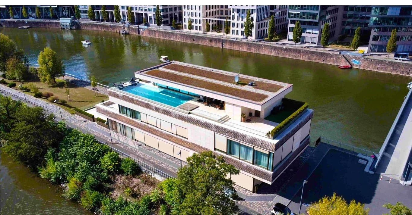 Aerial view of Main Suites with rooftop pool and Main River